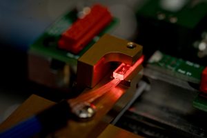 Device-level testing of a photonic component.