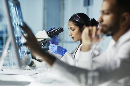Scientist Working on Computer In Modern Laboratory Scientist Working on Computer In Modern Laboratory
NOTE TO INSPECTOR: all graps, dna models, charts are made by me