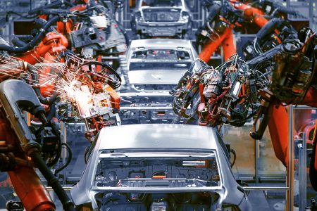 In the industrial production workshop, the robot arm of the automobile production line is working